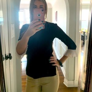 Black sweater with ruffle sleeves